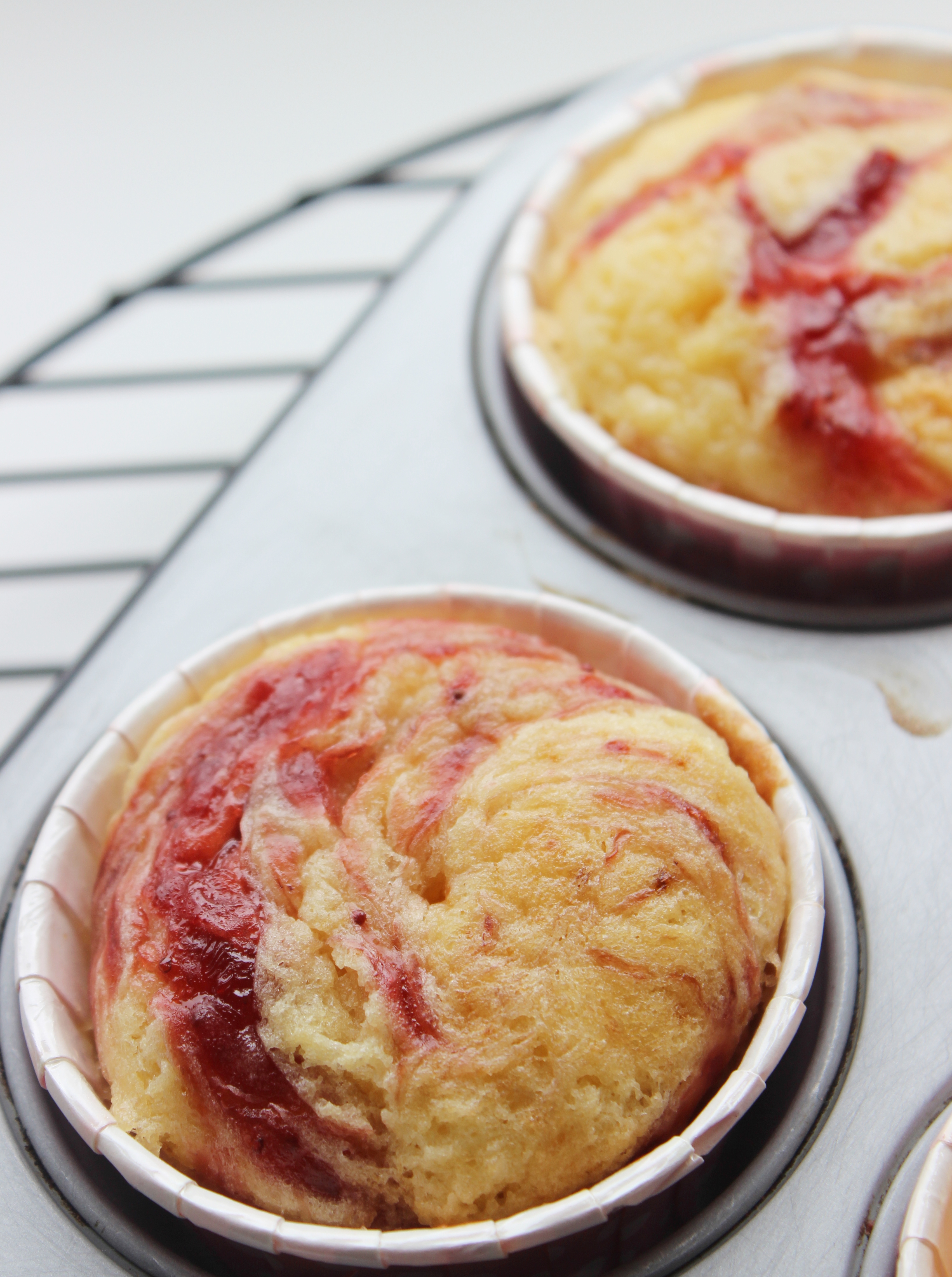 Vanilla Buttermilk Cupcakes with strawberry preserve swirl