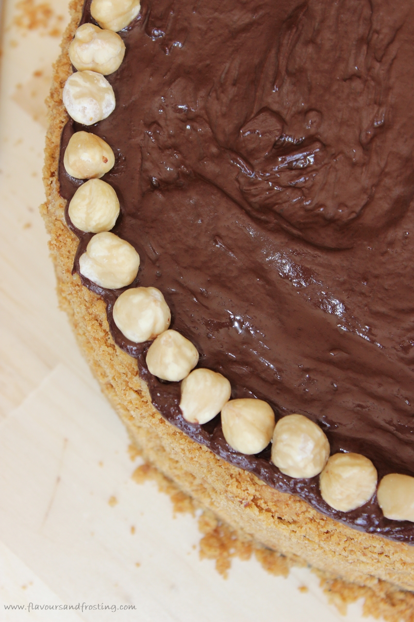 baked coffee cheesecake on a cookie and hazelnut crust, topped with dark chocolate ganache
